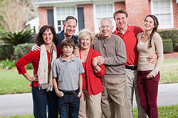 Male high school student looking closely at computer screen